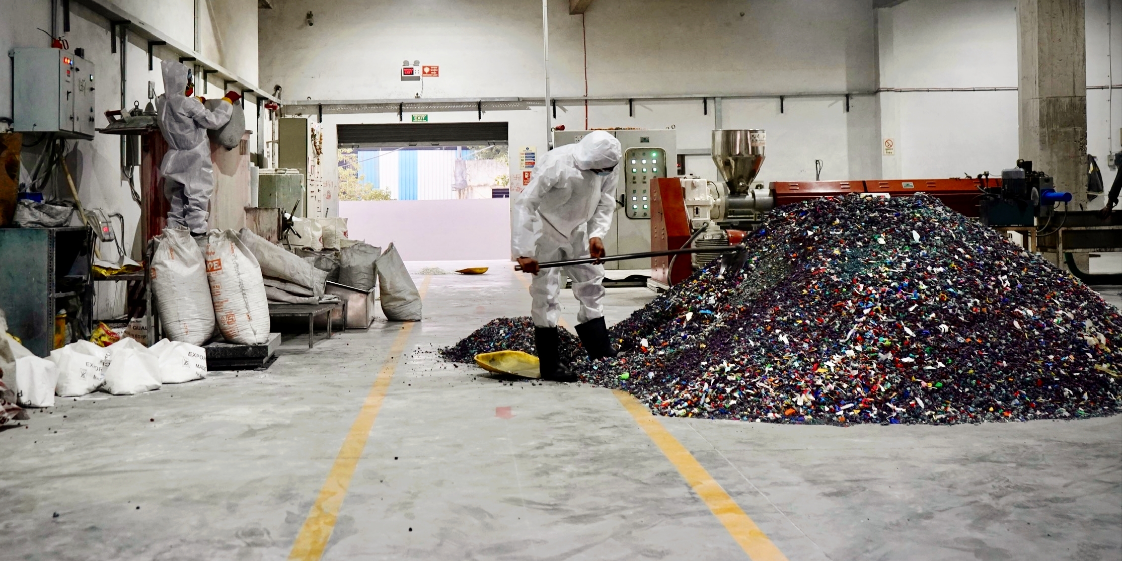 Waste Material Processing with Worker at Plant