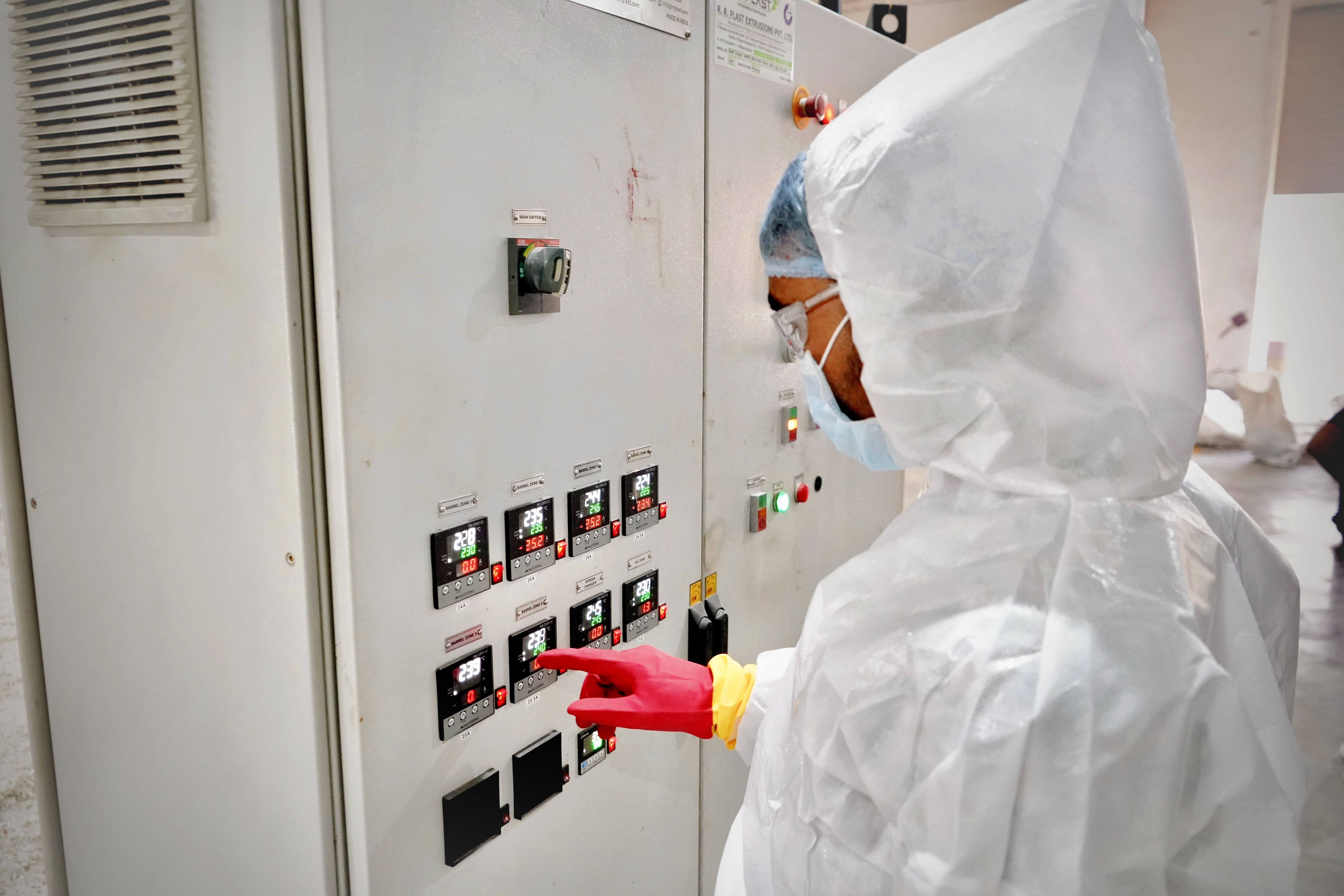 Worker Operating Electric Grid Machine
